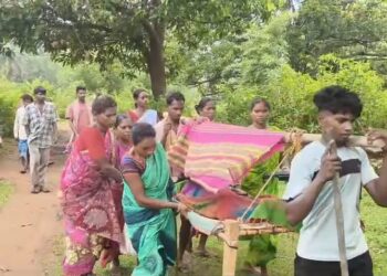 Pregnant Woman Carried on Cot