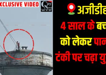 Police and administration safely rescue a man and child from a water tank.